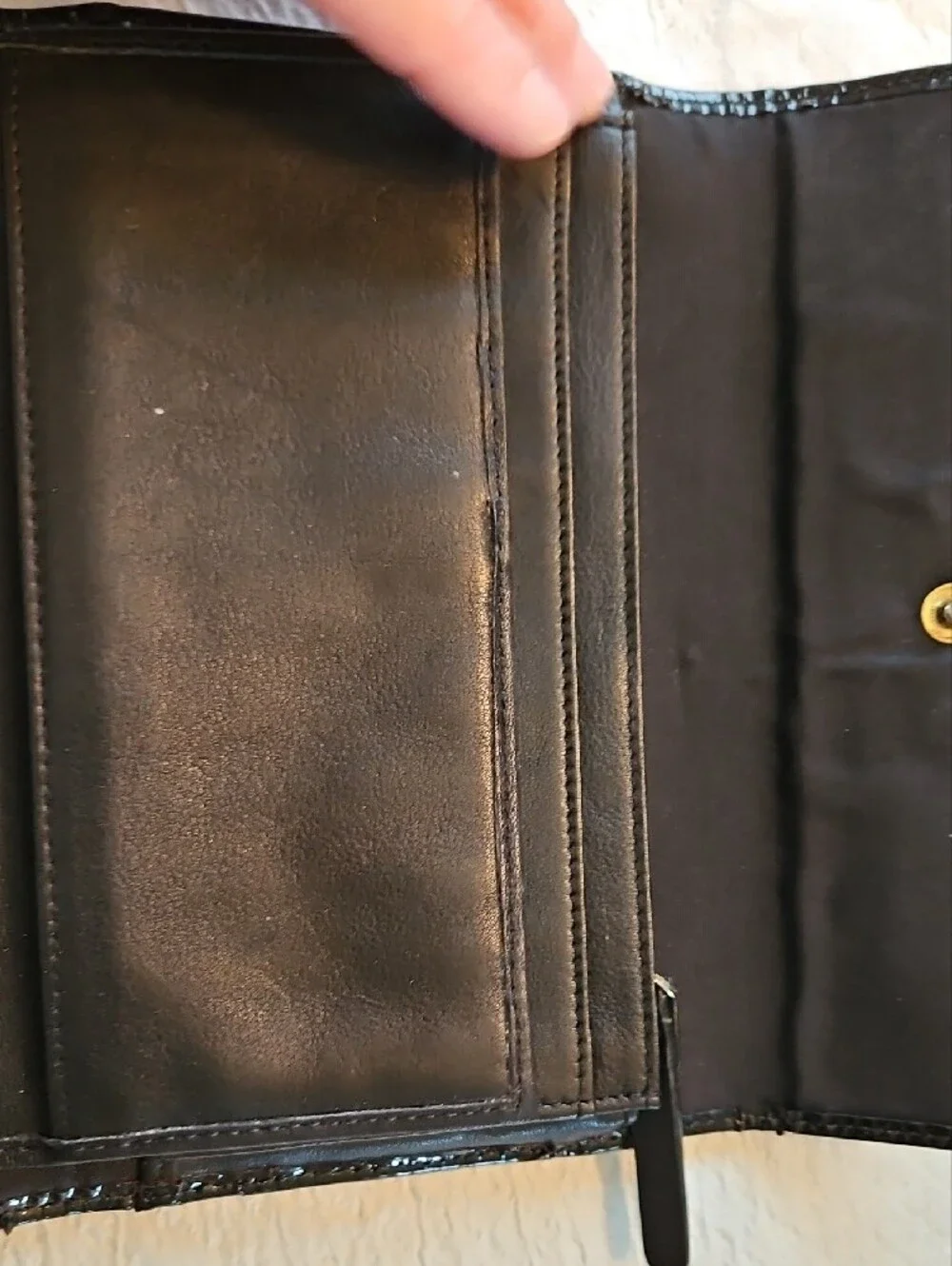 kate spade black wallet with gold-tone nameplate